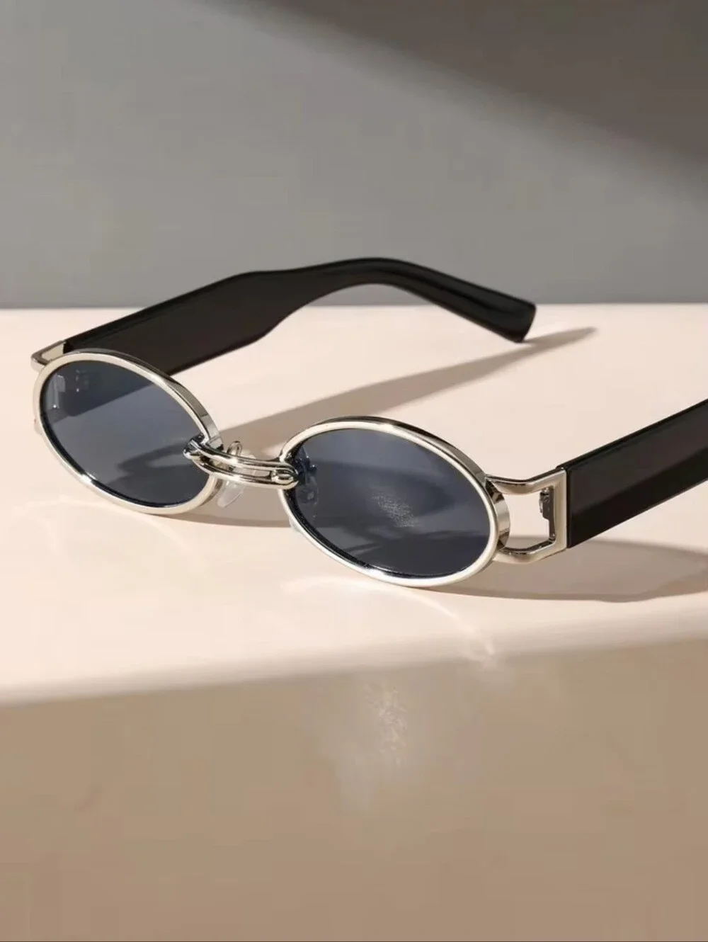 Round Black Sunglasses with Silver Accents